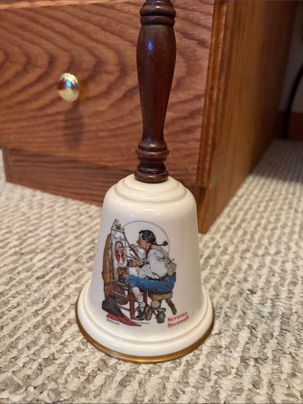 Norman Rockwell Cream and Brown Porcelain Hand Bell with Artist Illustration